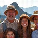 The Johnson family, three generations, smiling together in front of Machu Picchu
