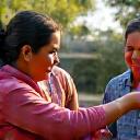 Two diverse individuals exchanging a respectful greeting with a slight bow, symbolizing cultural etiquette and respectful interaction.